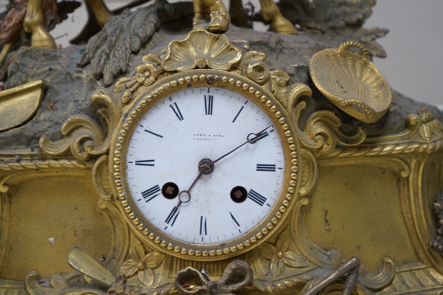 A 19th century French gilt spelter clock surmounted with a horse and rider, 39cm high